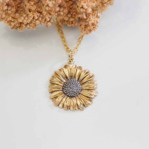 Gold filled halsketting met bronzen/zilveren madeliefje from Fairy Positron