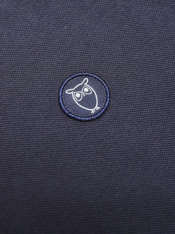 Polo T-Shirt Basic Badge Donkerblauw from Shop Like You Give a Damn